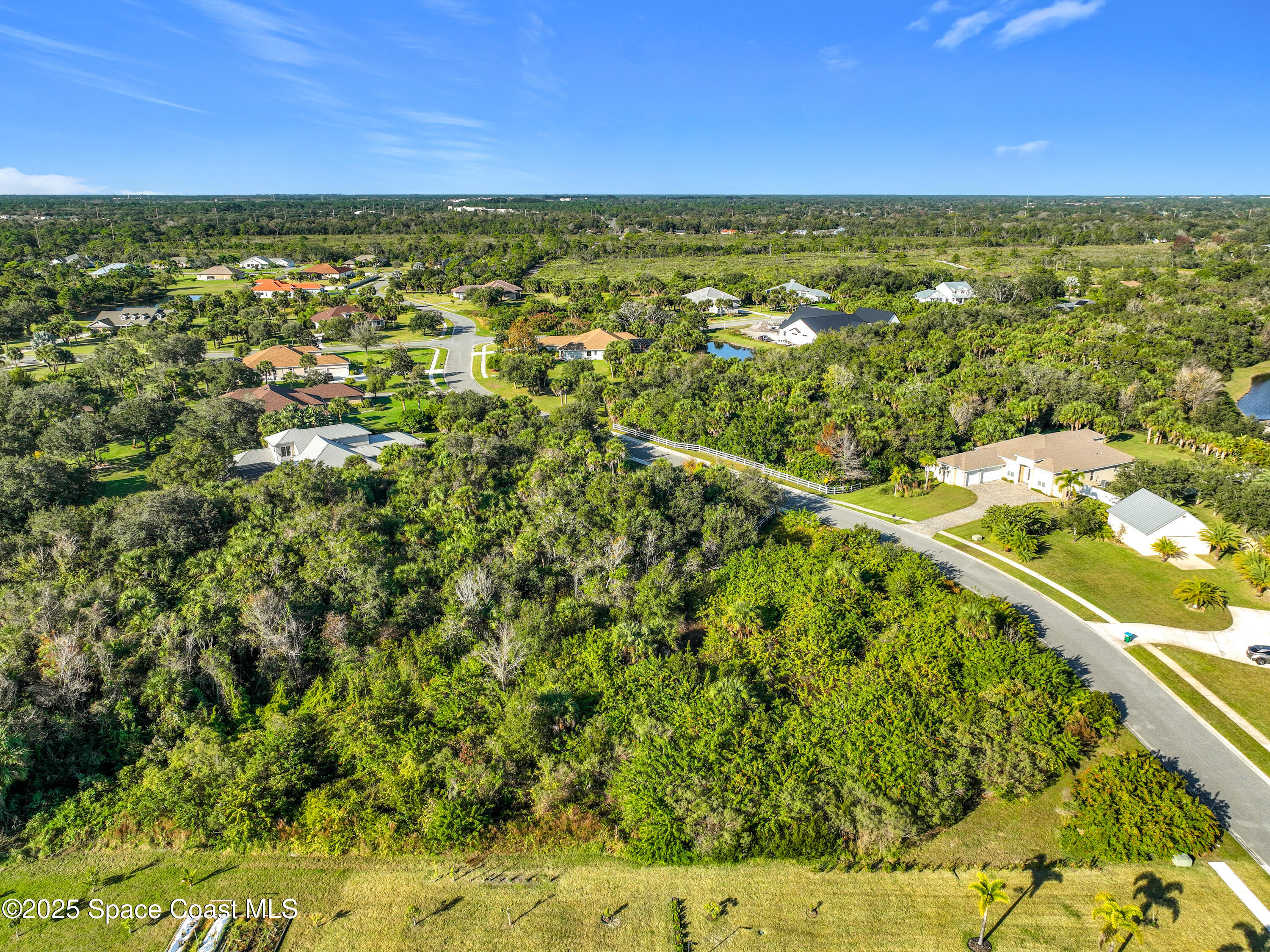 1495 Absaroka Lane Malabar, FL 32950 - Photo 10 of 16 a view of a lake with a city