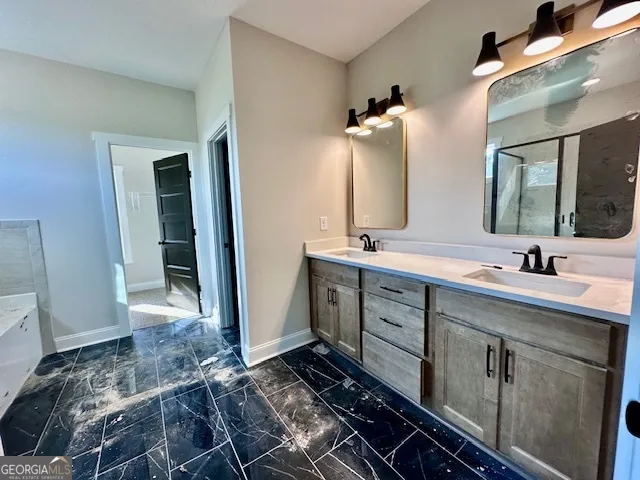 a bathroom with a double vanity sink mirror and toilet