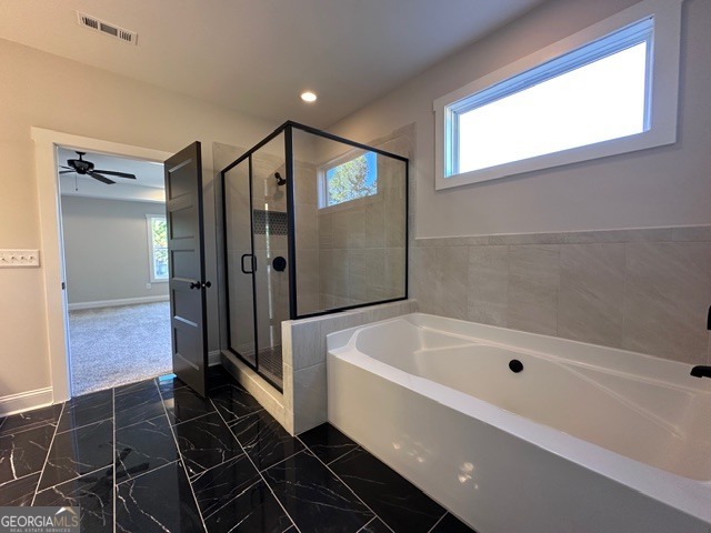 3647 Youngs Mill Road Hogansville, GA 30230 - Photo 14 of 34 a bathroom with a bathtub and a shower