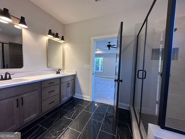 3647 Youngs Mill Road Hogansville, GA 30230 - Photo 15 of 34 a spacious bathroom with a double vanity sink a mirror and a shower