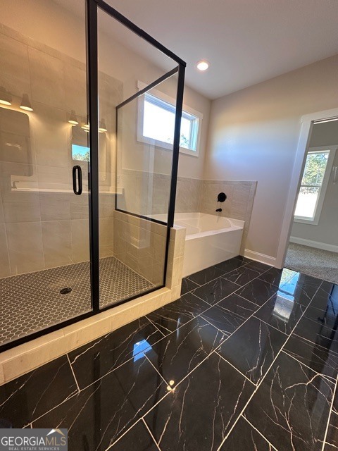 3647 Youngs Mill Road Hogansville, GA 30230 - Photo 17 of 34 a bathroom with a glass shower door and a glass door shower