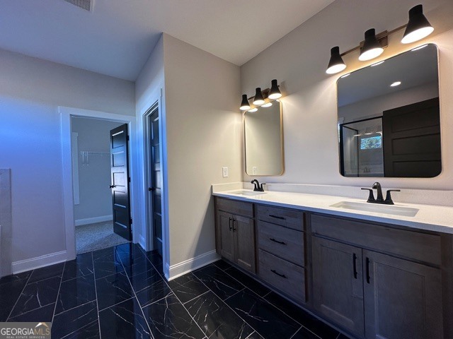 3647 Youngs Mill Road Hogansville, GA 30230 - Photo 18 of 34 a bathroom with a double vanity sink a and mirror