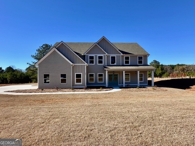 3647 Youngs Mill Road Hogansville, GA 30230 - Photo 2 of 34 a front view of a house with a yard