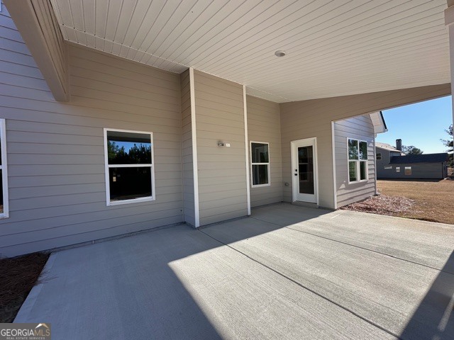 3647 Youngs Mill Road Hogansville, GA 30230 - Photo 33 of 34 a large white bed in a white room