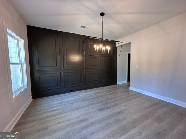 3647 Youngs Mill Road Hogansville, GA 30230 - Photo 4 of 34 a view of an empty room with wooden floor and a window