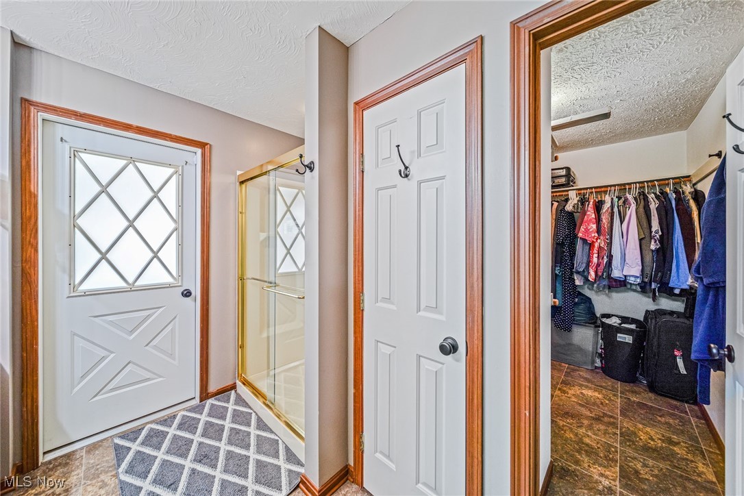 6834 Chapel Road Madison, OH 44057 - Photo 14 of 48 Primary walk-in closet & linen closet