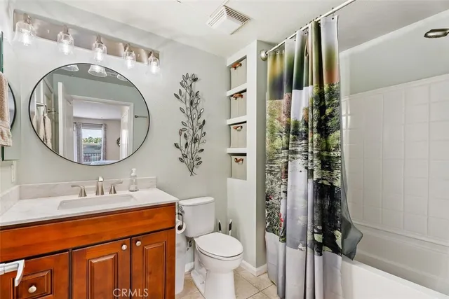 a bathroom with a toilet sink and shower