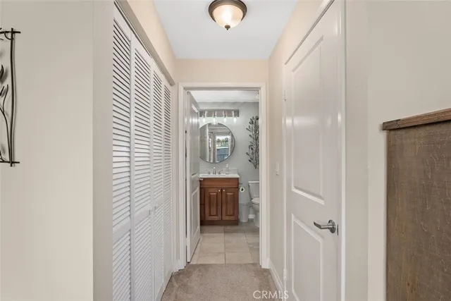 a view of a hallway view with wooden floor and staircase