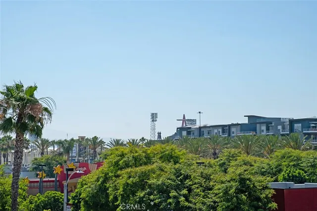 a view of a city with tall buildings and a street next to a large building