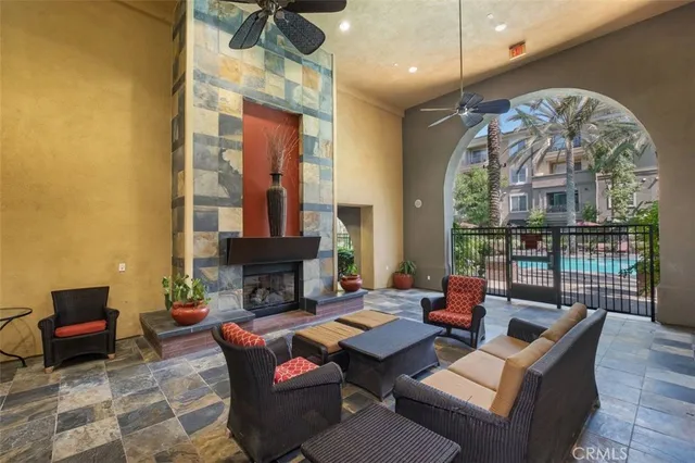 a living room with fireplace furniture and a chandelier