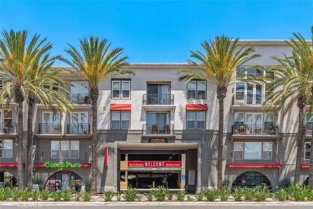 a front view of multi story residential apartment building with yard