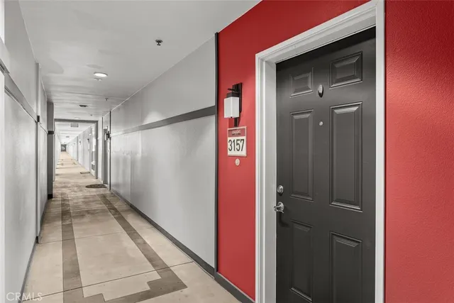 a bathroom with a glass shower door and a sink