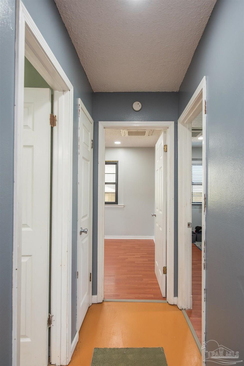 2322 Silversides Loop Pensacola, FL 32526 - Photo 13 of 29 a bedroom with a bed and a mirror