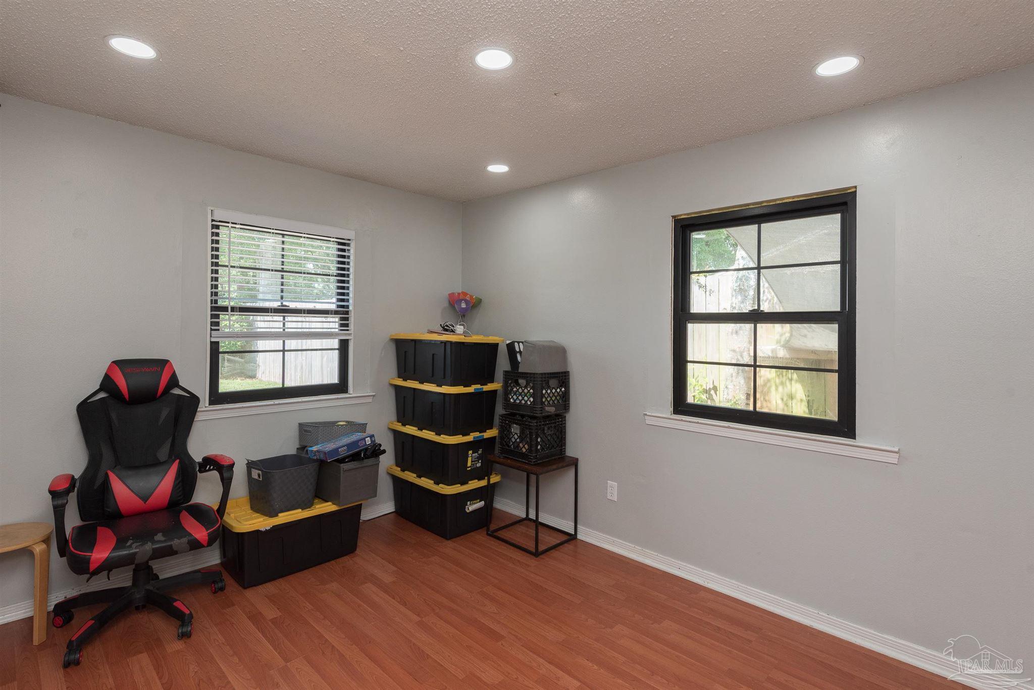 2322 Silversides Loop Pensacola, FL 32526 - Photo 14 of 29 a living room with furniture and wooden floor