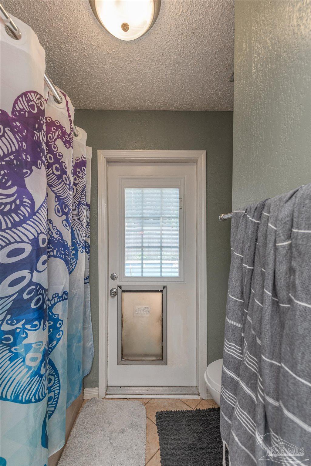 2322 Silversides Loop Pensacola, FL 32526 - Photo 18 of 29 a view of a livingroom with wooden floor and a window