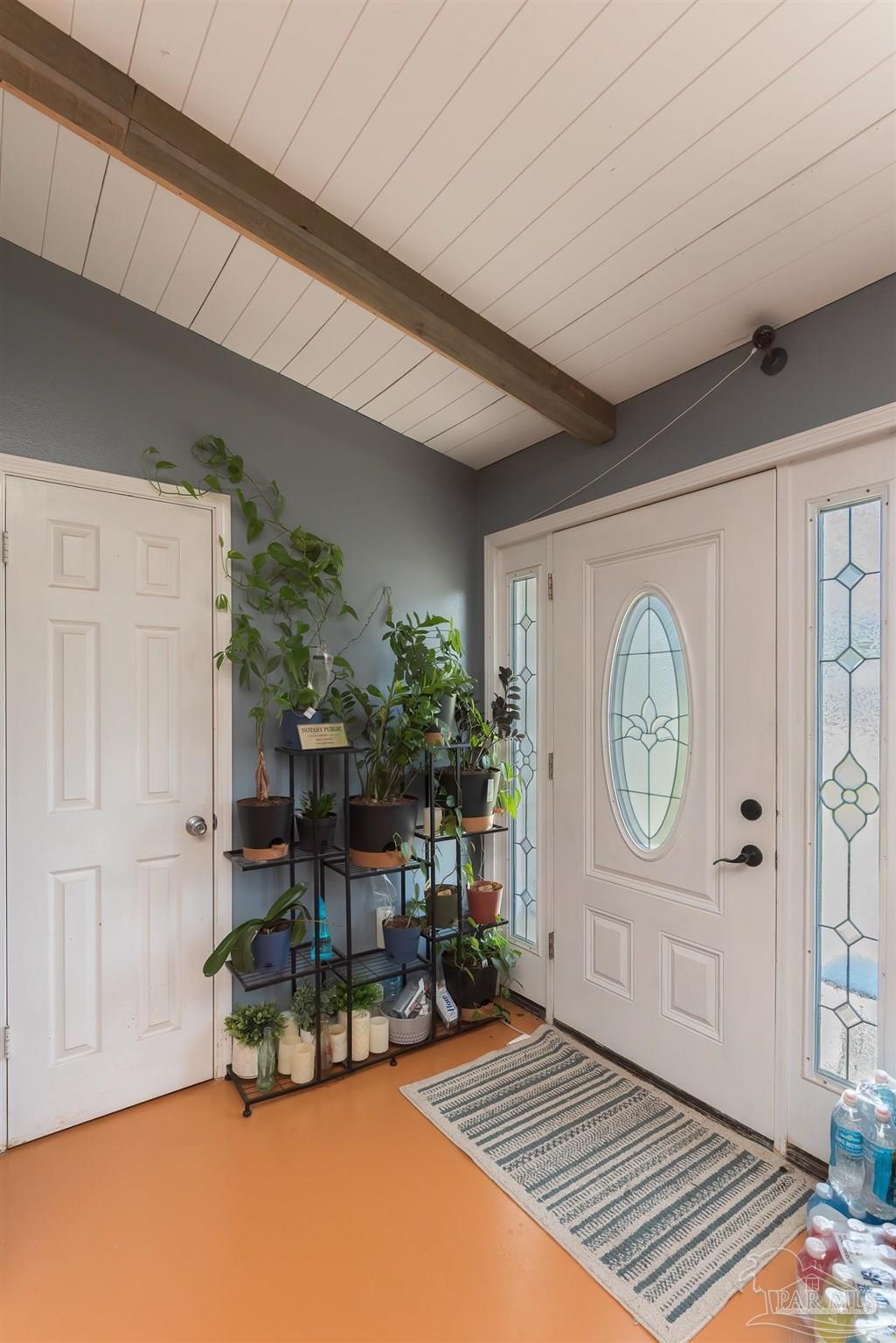 2322 Silversides Loop Pensacola, FL 32526 - Photo 20 of 29 a living room with furniture a clock and a window