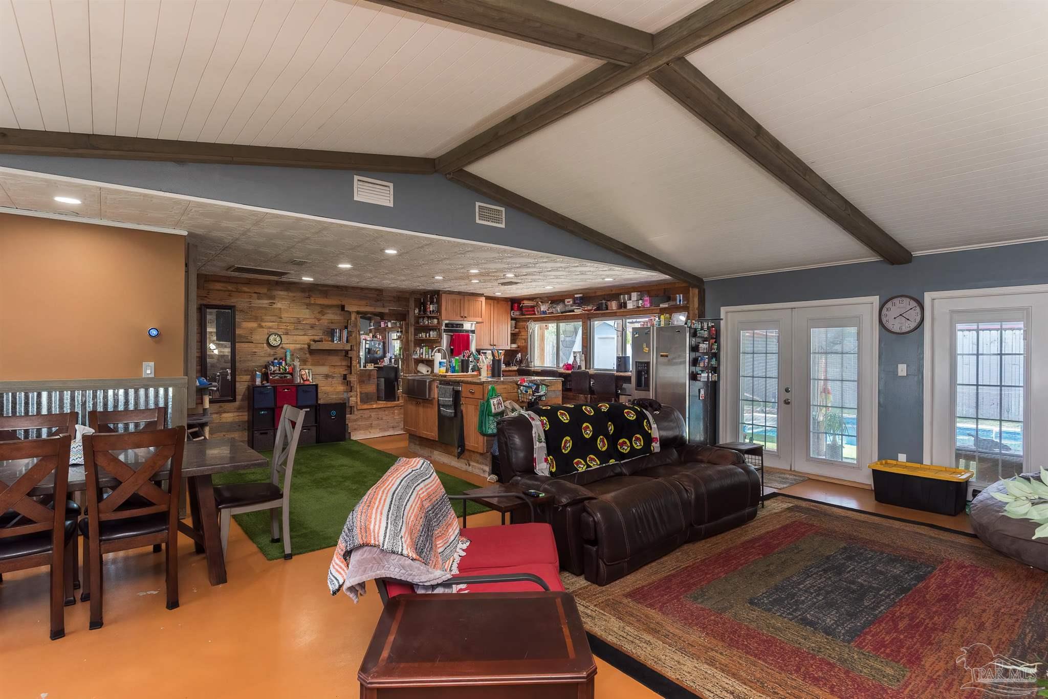 2322 Silversides Loop Pensacola, FL 32526 - Photo 2 of 29 a living room with furniture and a floor to ceiling window