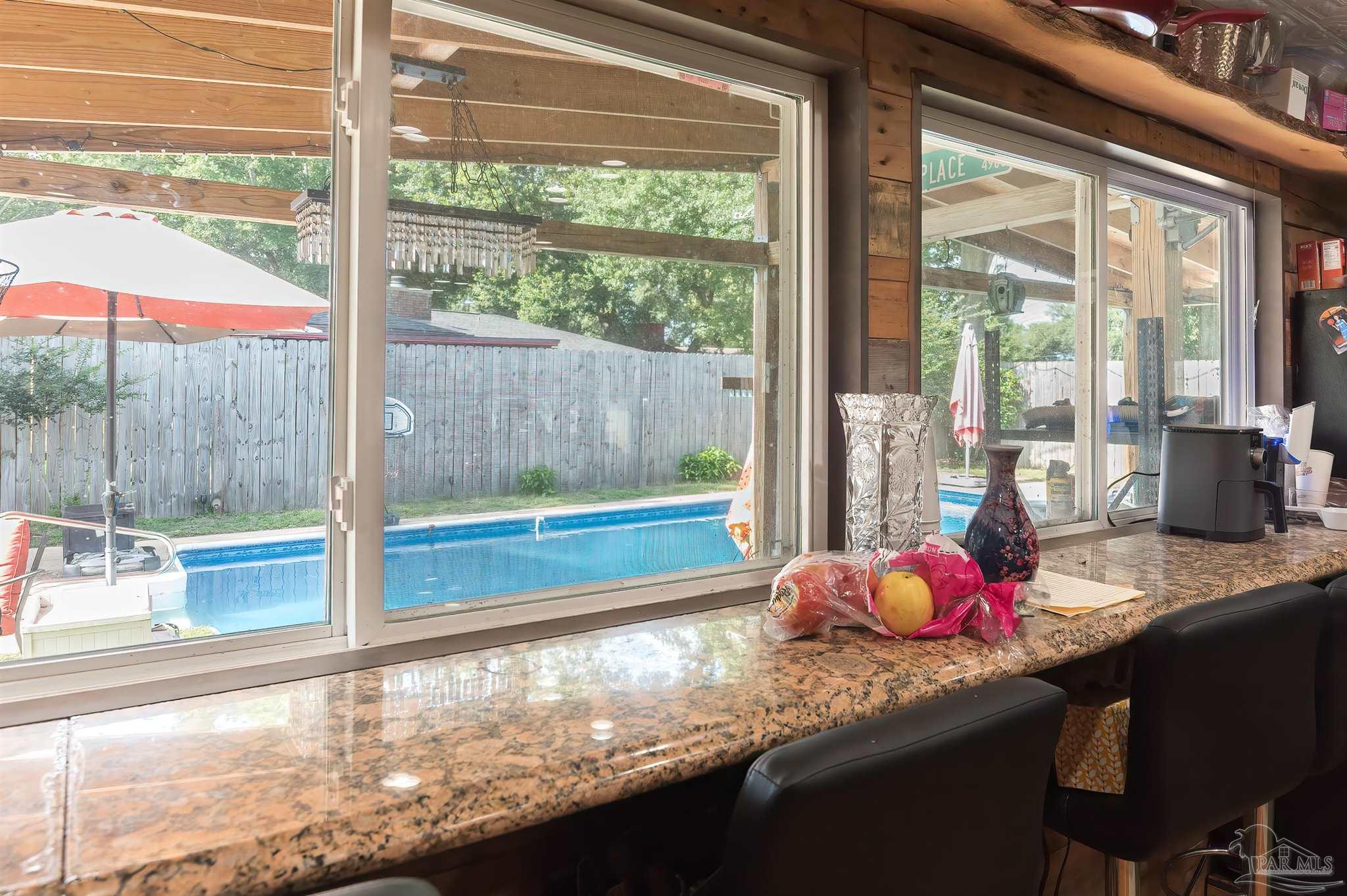 2322 Silversides Loop Pensacola, FL 32526 - Photo 21 of 29 a room with granite countertop a sink and a wooden floor