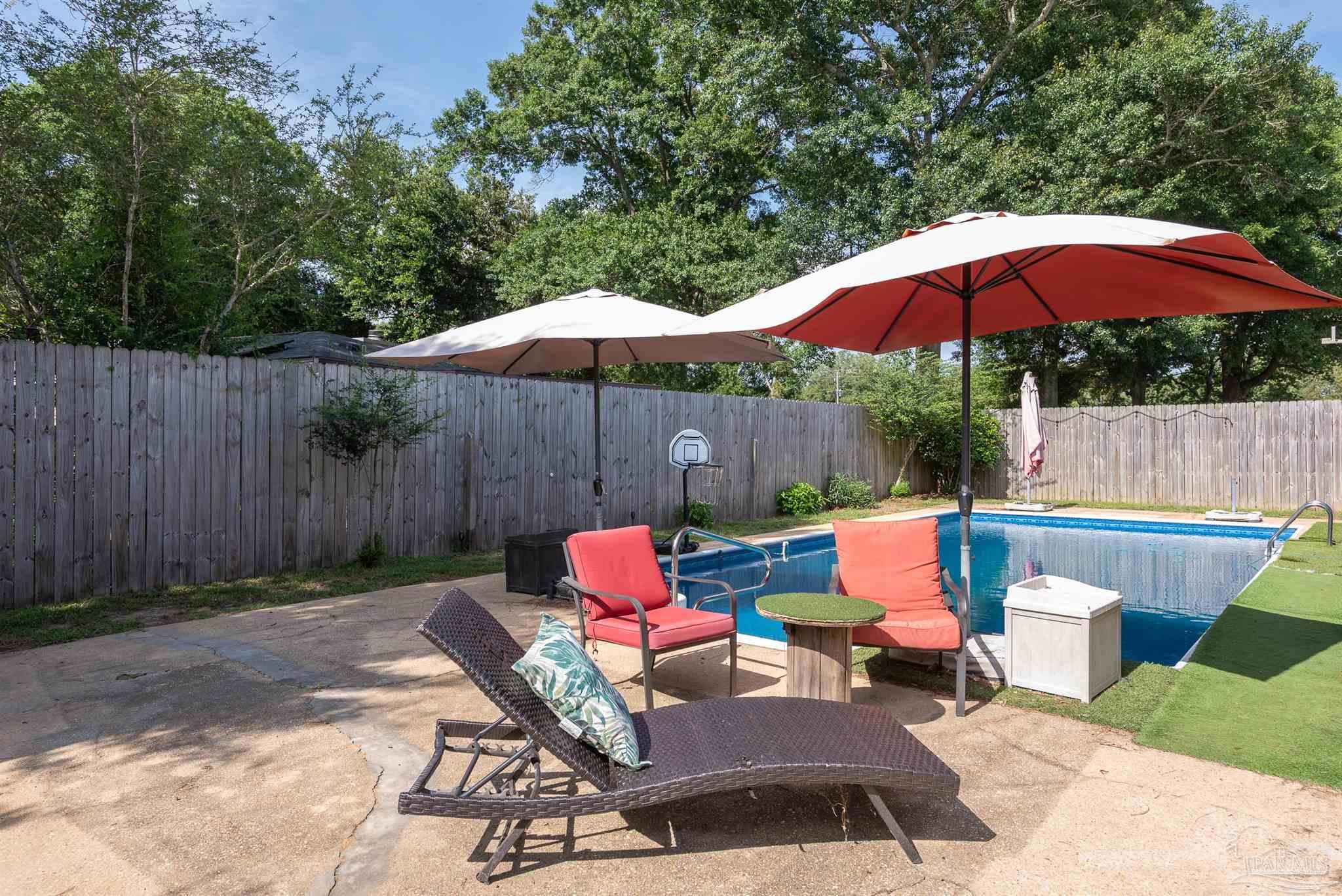 2322 Silversides Loop Pensacola, FL 32526 - Photo 24 of 29 a patio view with patio furniture and umbrella