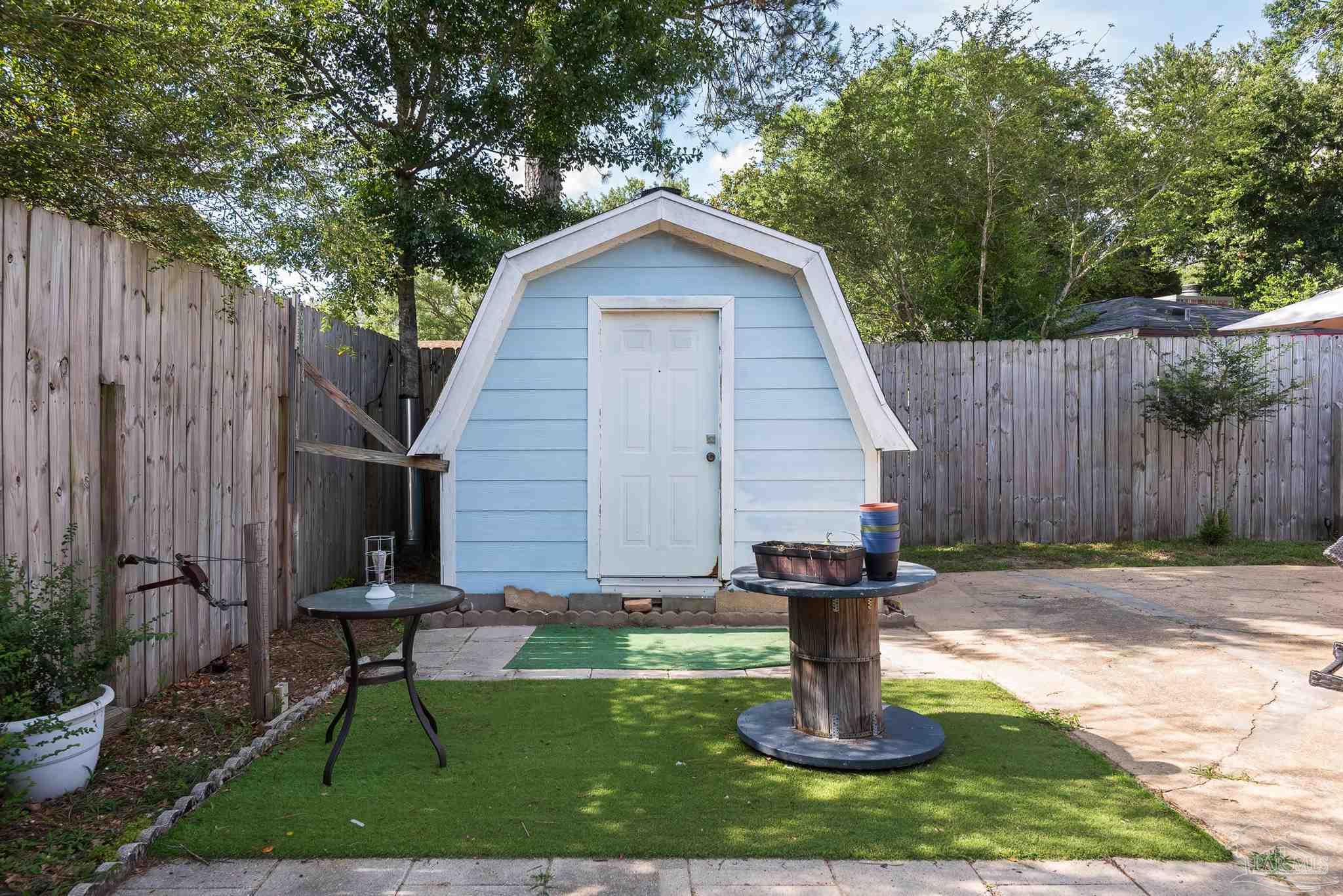 2322 Silversides Loop Pensacola, FL 32526 - Photo 25 of 29 a view of a house with backyard and a tree