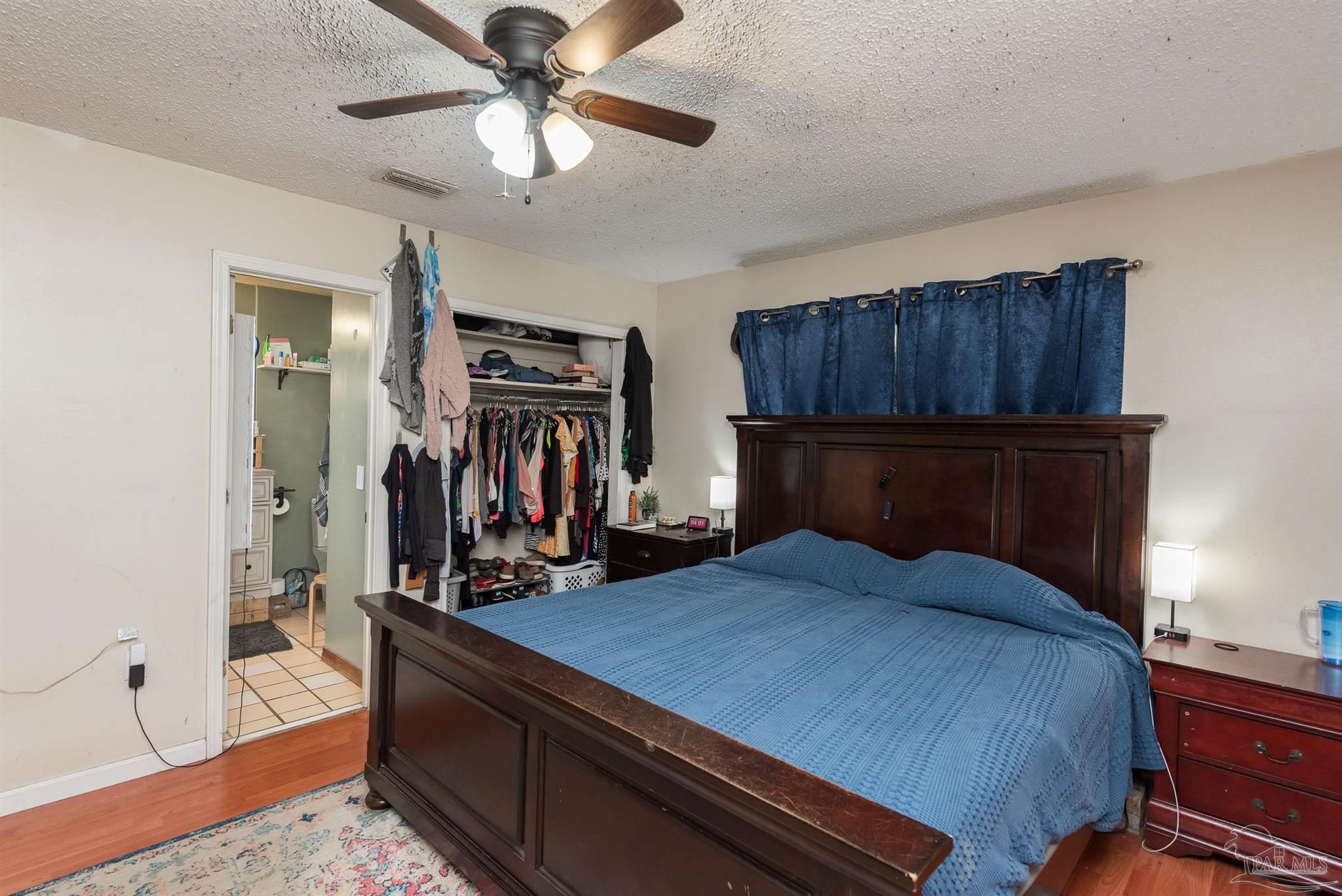 2322 Silversides Loop Pensacola, FL 32526 - Photo 9 of 29 a bed room with a bed and dresser