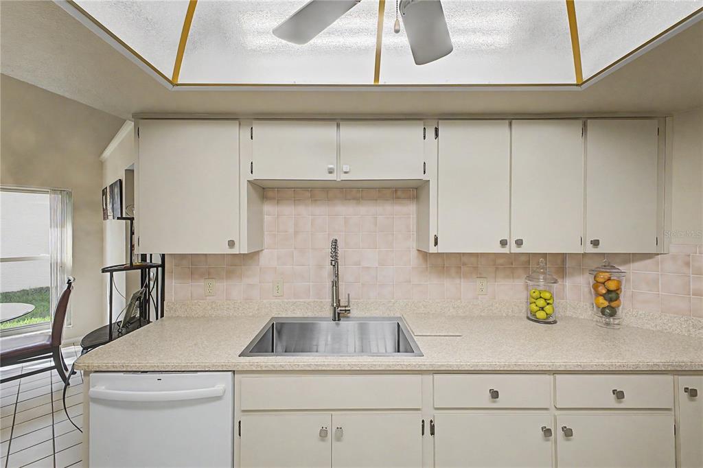2662 Appleleaf Court Spring Hill, FL 34606 - Photo 14 of 47 a kitchen with a sink a cabinets and appliances