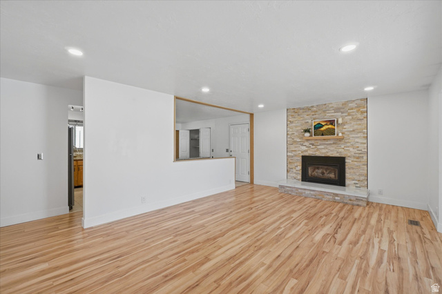 392 Perrine Drive Midvale, UT 84047 - Photo 4 of 37 Gorgeous wood floors, gas fireplace.