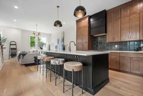 a kitchen with counter top space cabinets and appliances
