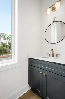 a bathroom with a sink and mirror