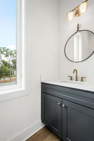a bathroom with a sink and mirror