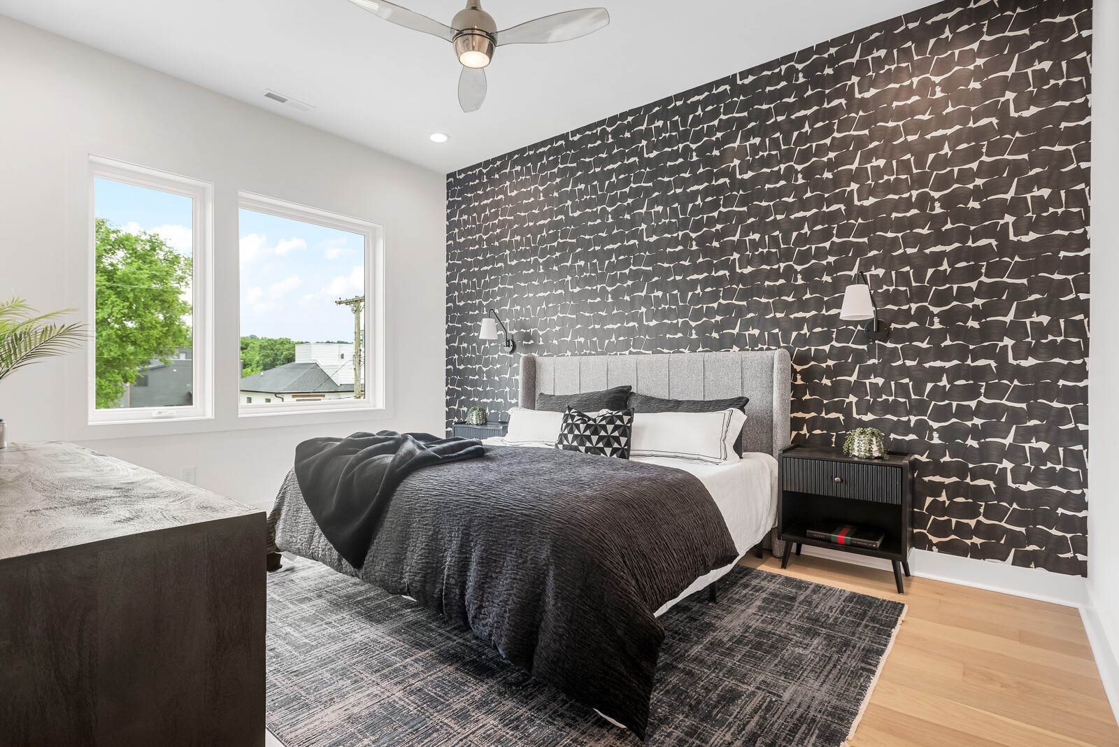 6104 Cowden Avenue, Unit A Nashville, TN 37209 - Photo 21 of 40 a bed sitting in a bedroom next to a window with a balcony