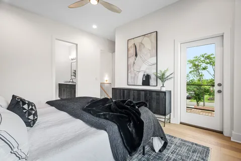 a bedroom with a bed and a window