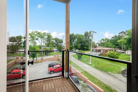 a balcony with an outdoor seating