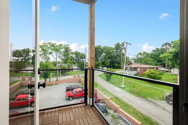 a balcony with an outdoor seating