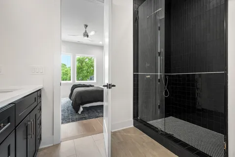 a bathroom with a tub and a shower