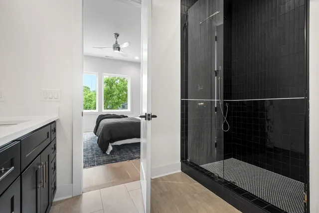 a bathroom with a tub and a shower