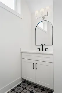 a bathroom with a sink and vanity