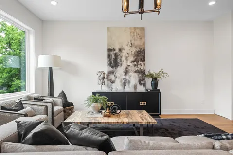 a living room with furniture and a lamp