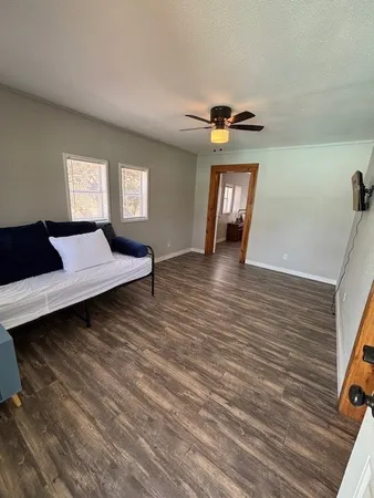 a view of a livingroom with furniture and window