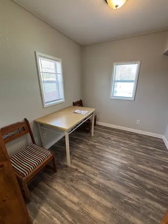 a bed room with a bed and a chandelier
