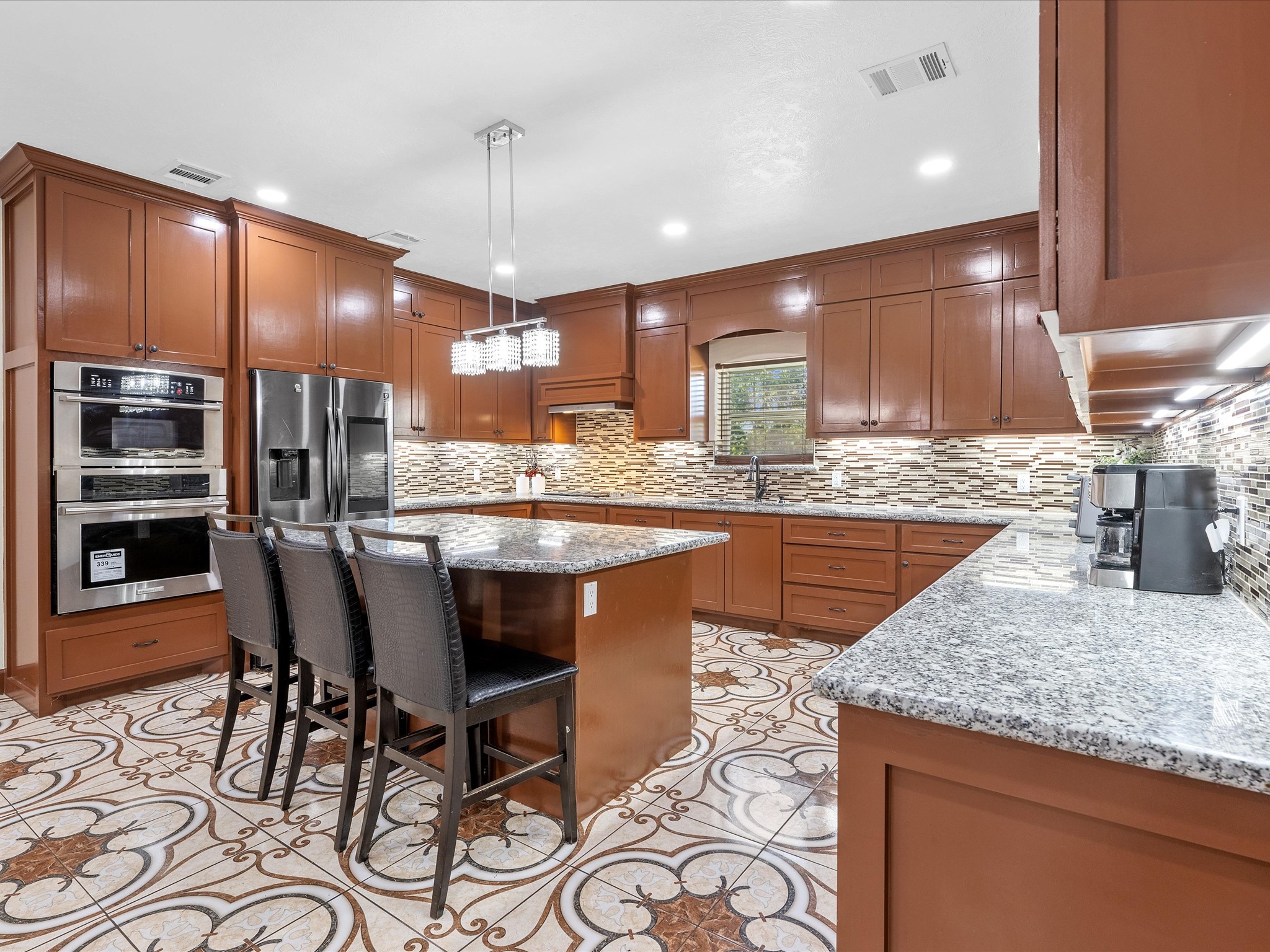 886 Zilss Road La Grange, TX 78945 - Photo 11 of 50 a kitchen with stainless steel appliances granite countertop a sink counter space and cabinets