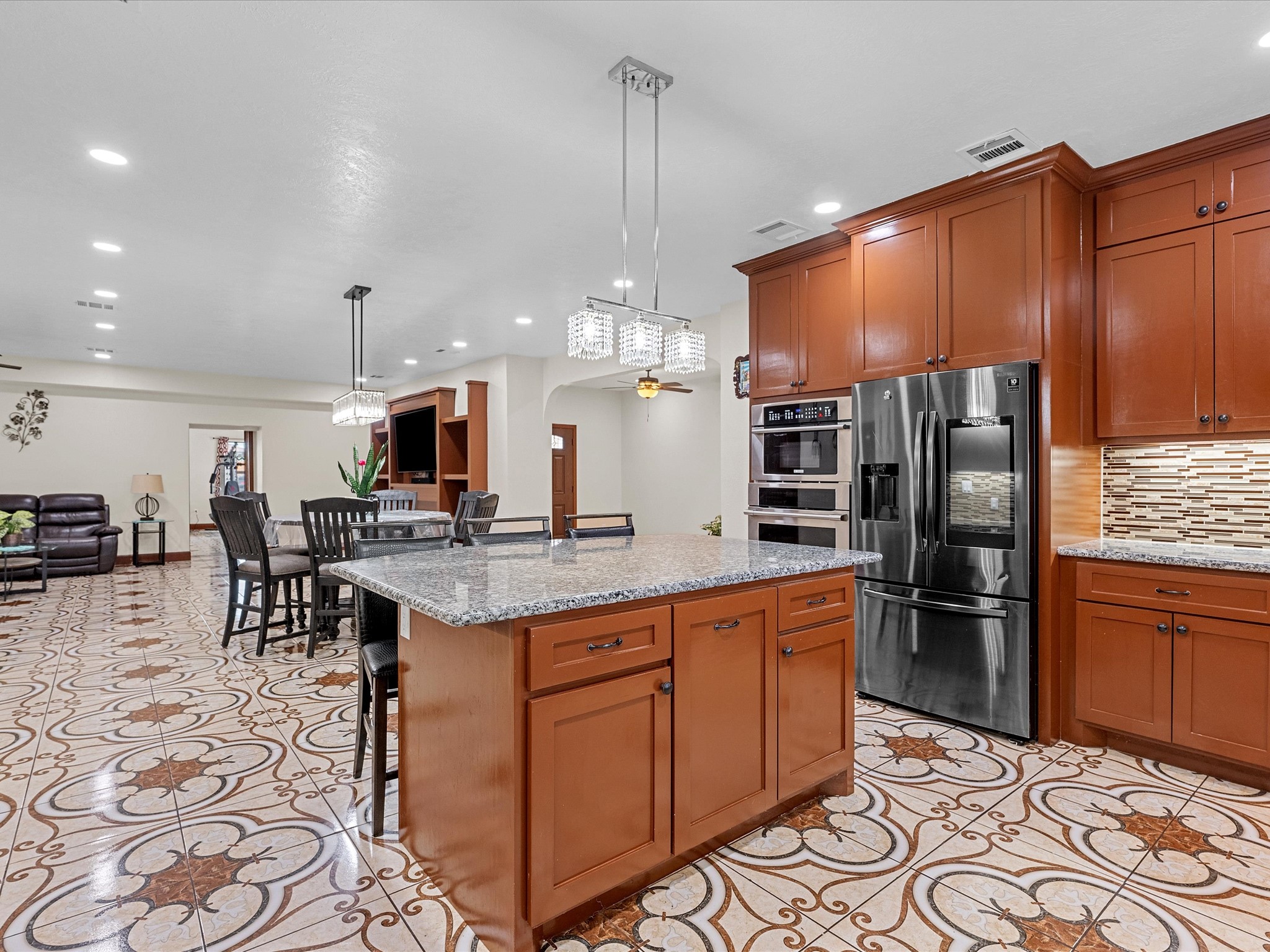 886 Zilss Road La Grange, TX 78945 - Photo 12 of 50 a kitchen with stainless steel appliances granite countertop a sink a stove and a refrigerator