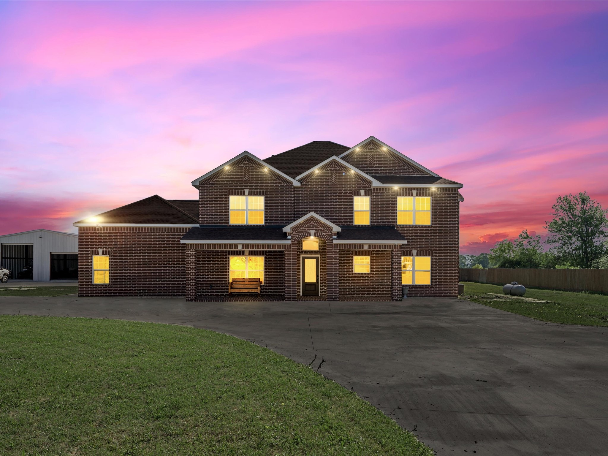 886 Zilss Road La Grange, TX 78945 - Photo 3 of 50 a front view of a house with a garden