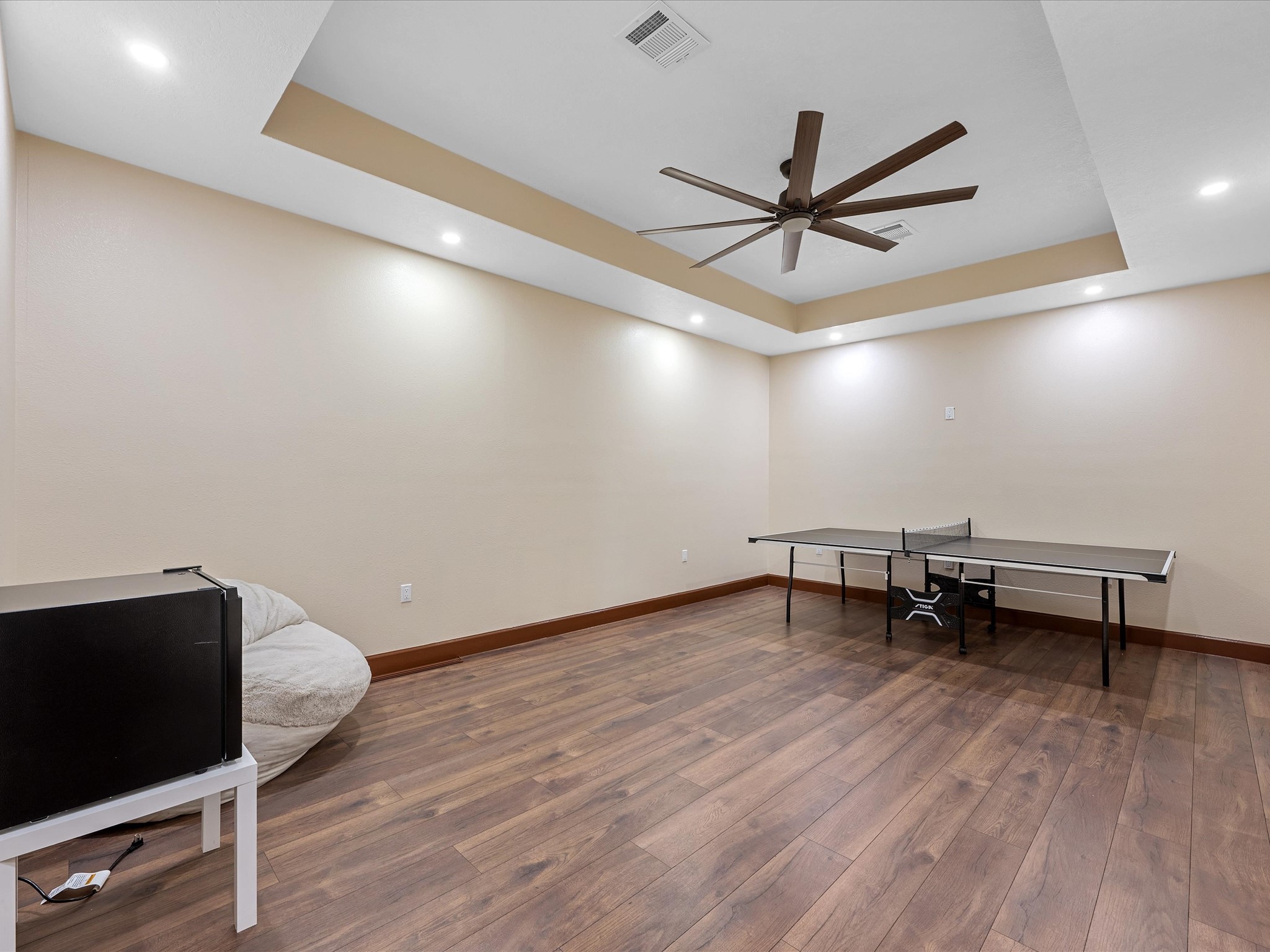 886 Zilss Road La Grange, TX 78945 - Photo 32 of 50 a view of a room with wooden floor and a ceiling fan