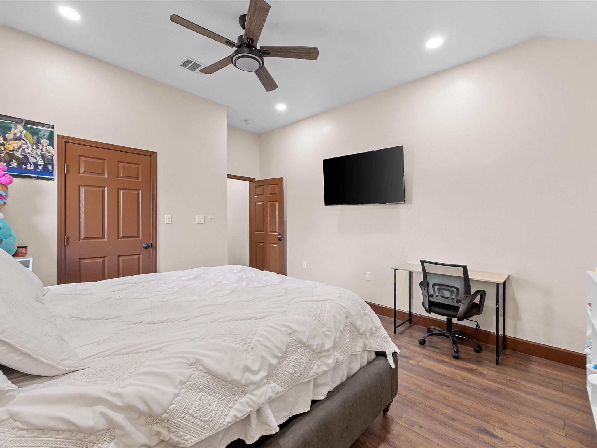 886 Zilss Road La Grange, TX 78945 - Photo 34 of 50 a bedroom with a bed and a flat screen tv