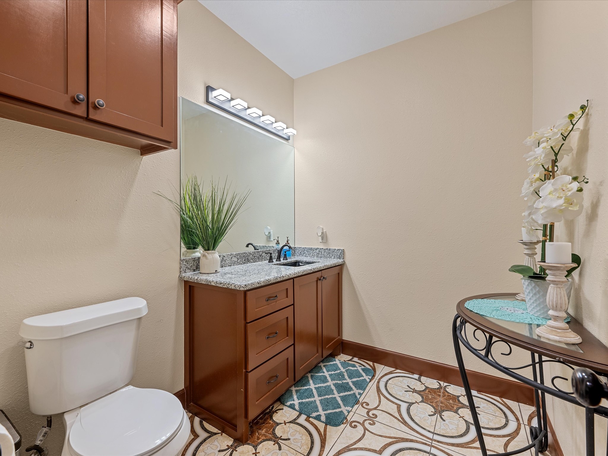886 Zilss Road La Grange, TX 78945 - Photo 39 of 50 a bathroom with a granite countertop sink and a mirror