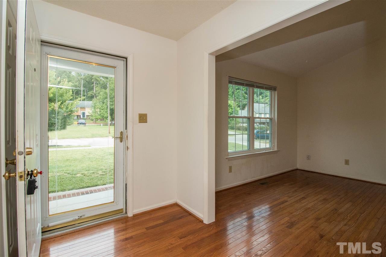 2300 Carthage Circle Raleigh, NC 27604 - Photo 2 of 18 a view of an empty room with wooden floor and a window