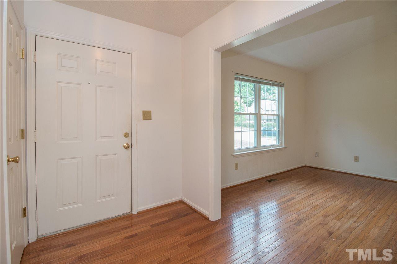 2300 Carthage Circle Raleigh, NC 27604 - Photo 3 of 18 an empty room with wooden floor and windows