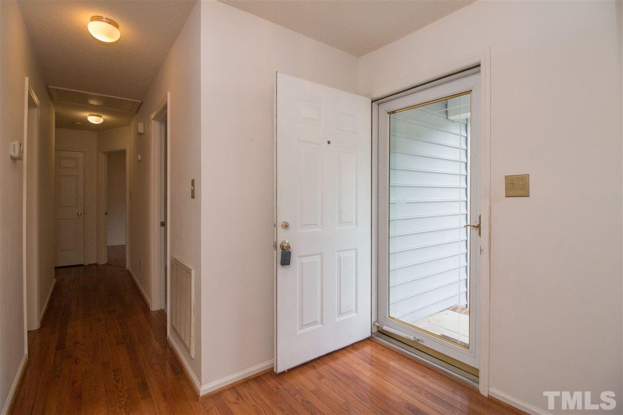 2300 Carthage Circle Raleigh, NC 27604 - Photo 4 of 18 a view of a hallway with wooden floor