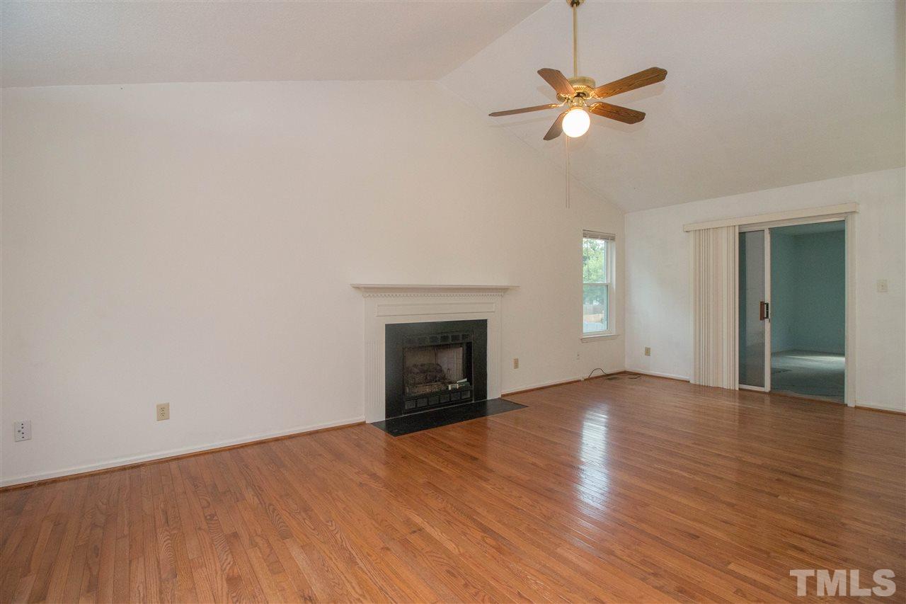 2300 Carthage Circle Raleigh, NC 27604 - Photo 5 of 18 wooden floor in an empty room with a window